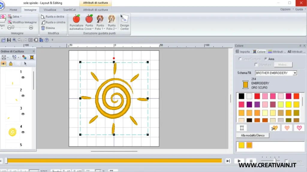 Area di lavoro di Layout & Editing in PE-Design 11 che mostra il ricamo completato di un sole stilizzato e la palette dei colori attiva
